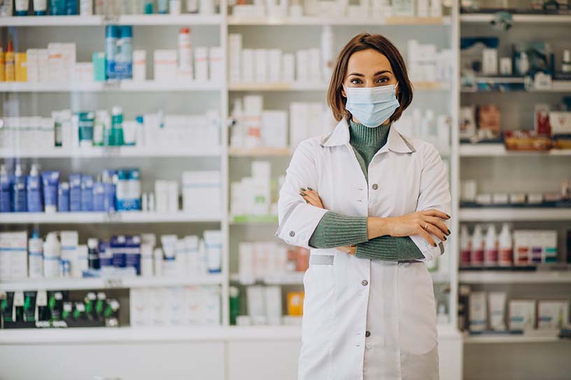Young woman pharmacist at pharmacy